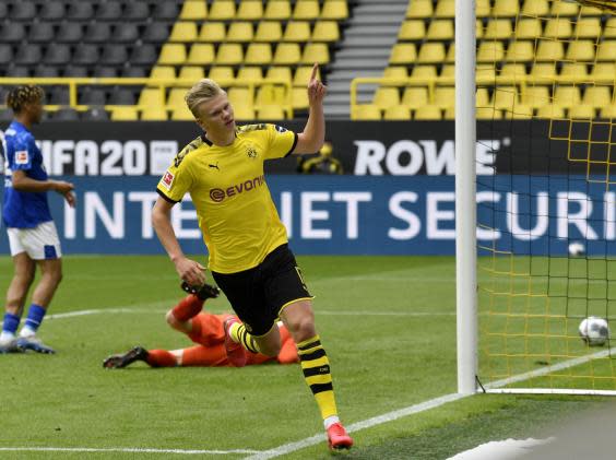 Haaland celebrates opening the scoring against Schalke (EPA)