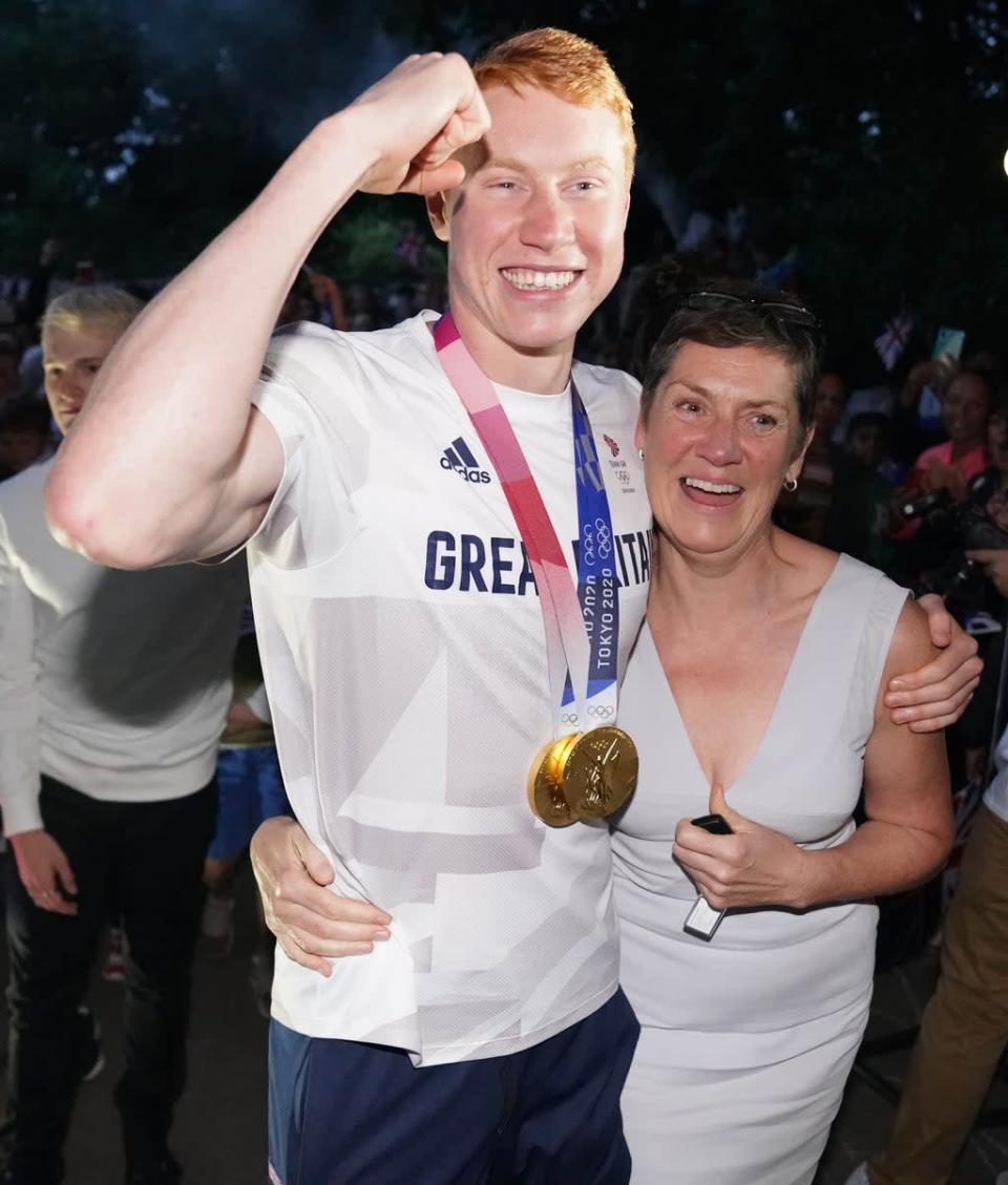 British swimmer Tom Dean, with his mother Jacquie Hughes, at a welcome home party (Jonathan Brady/PA) (PA Wire)