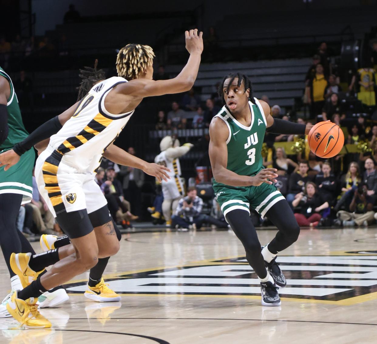 Jacksonville University's Kevion Nolan (3) looks for an opening while being guarded by VCU's Tobi Lawal during last week's game against the Rams in Richmond, Va.