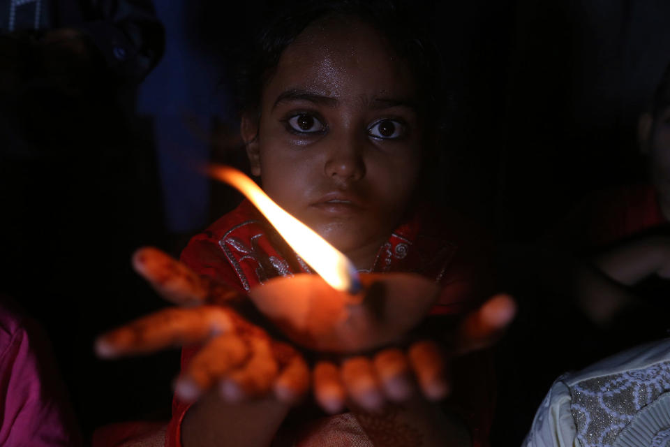 <p>A Pakistani girl attends a vigil on the World Thalassemia Day with others Karachi, Pakistan, Monday, May 8, 2017. Pakistan also observed the World Thalassemia Day, medical institutes organized numerous events to raise awareness about the disease. (AP Photo/Shakil Adil) </p>