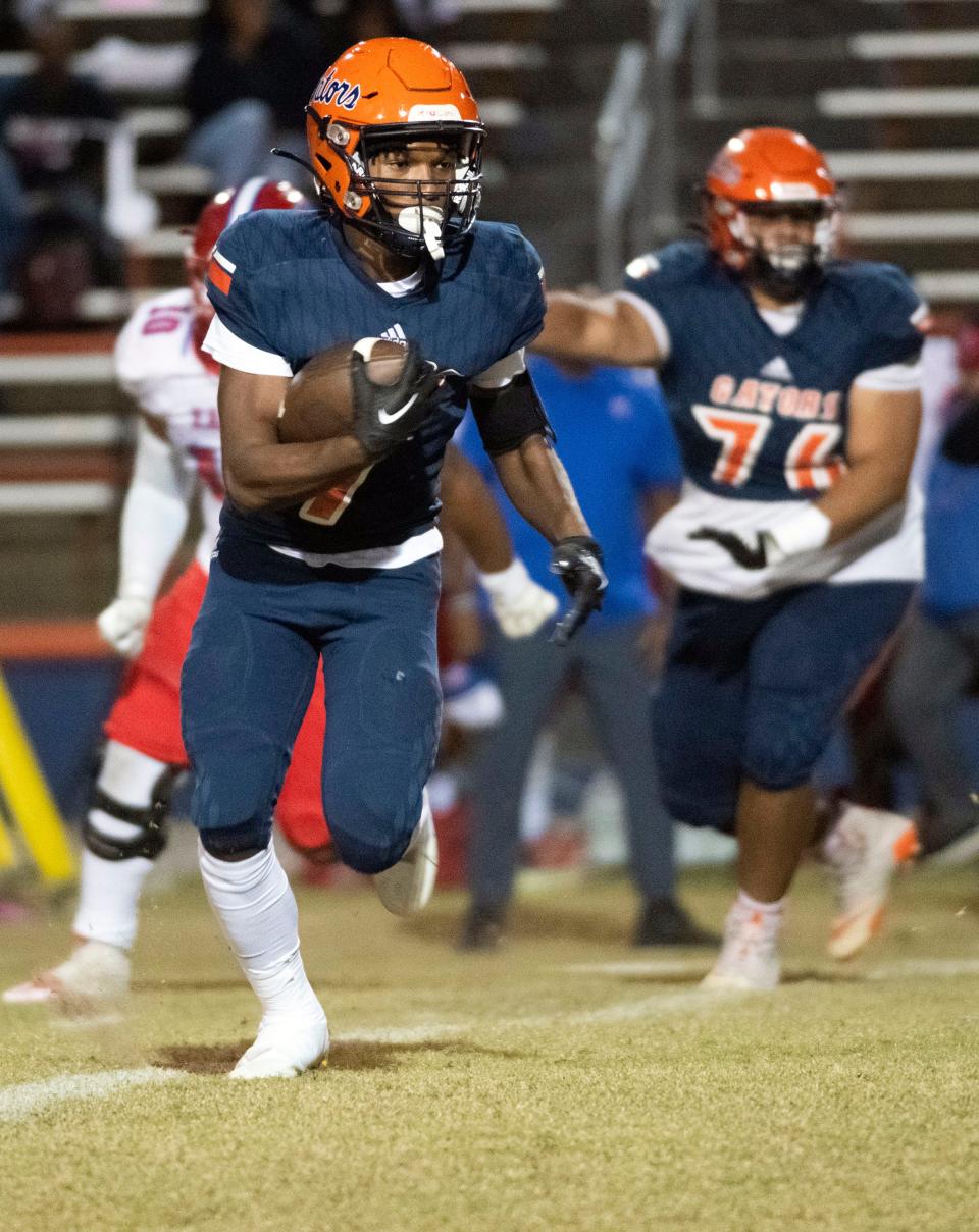 Escambia running back Keimani Turner (No. 7) looks for a place to run during Friday night's District 1-3S matchup against the Pine Forest Eagles.