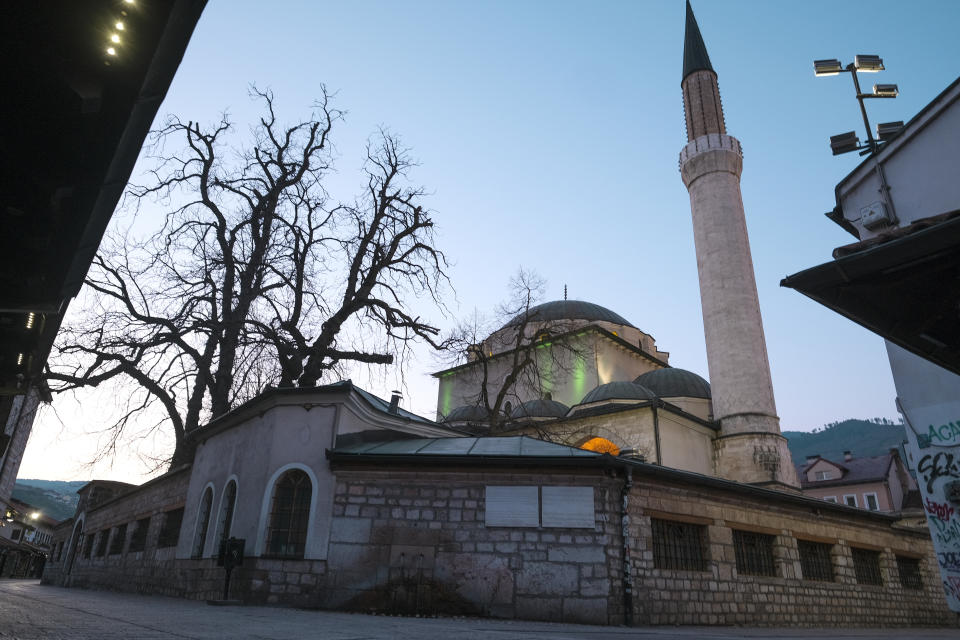 In this Friday, April 10, 2020 photo the streets around the 16th century built Gazi Husrev-beg Mosque are empty in Sarajevo, Bosnia, due to the national lockdown the authorities have imposed attempting to limit the spread of the new coronavirus. Traditionally, hundreds, sometimes thousands of residents who fled during the 1990s war and the years of economic instability that followed, return to Sarajevo each spring to celebrate religious or cultural holidays with family and friends. This year, nobody is returning leaving the streets and places for religious gatherings empty as families and friends celebrate the holidays apart due to the COVID-19 lockdown. (AP Photo/Kemal Softic)