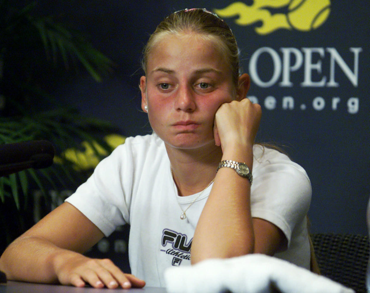 Australia's Jelena Dokic reacts during a news conference at the U.S. Open tennis tournament in New York, Aug. 31, 2000, after the completion of her singles match, the day after her father was removed from the grounds of the National Tennis Center by security, amid a stream of curses and insults, and barred from the rest of the tournament. (AP)