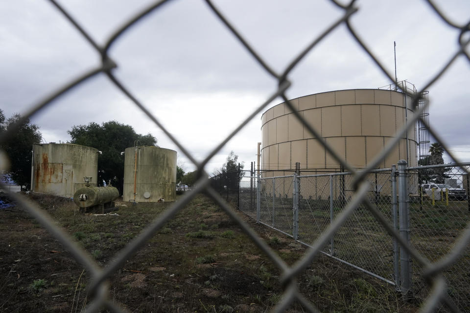 A newer water tank, right, is shown next to two older tanks at the San Jerardo cooperative in Salinas, Calif., Wednesday, Dec. 20, 2023. Some California farming communities have been plagued for years by problems with their drinking water due to nitrates and other contaminants in the groundwater that feeds their wells. (AP Photo/Jeff Chiu)