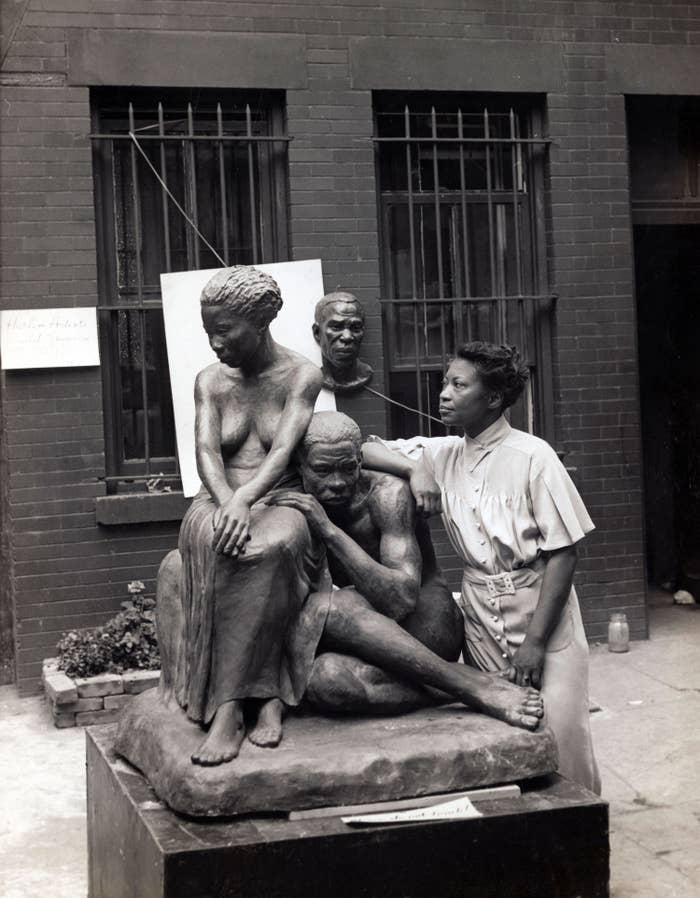 artist August Savage with one of her sculptures