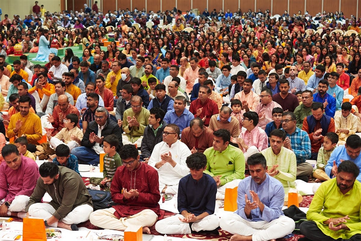 Devotees at the BAPS Shri Swaminarayan Mandir in Edison celebrate Diwali in 2022. Known as the Hindu festival of lights, Diwali is a joyful holiday that originated in India.