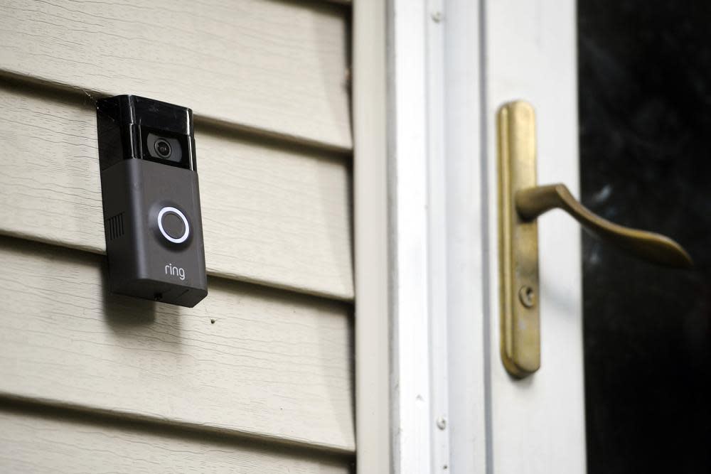 A Ring doorbell camera is displayed outside a home in Wolcott, Conn., on July 16, 2019. (AP Photo/Jessica Hill, File)