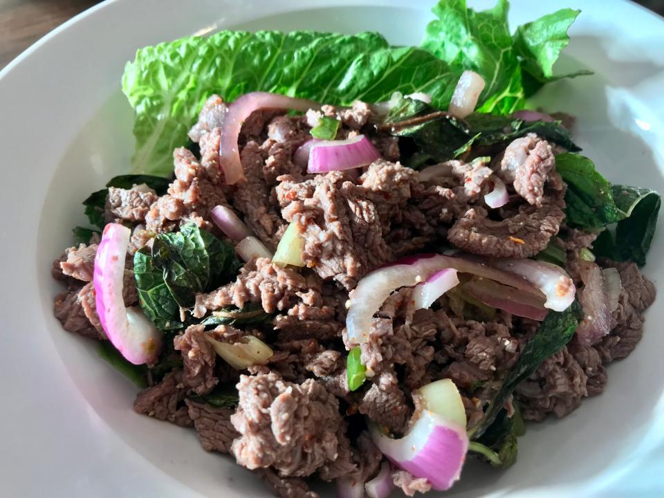 Beef laab, the meat salad seasoned with mint, cilantro, lime juice and fish sauce, is on the menu at Sticky Rice.