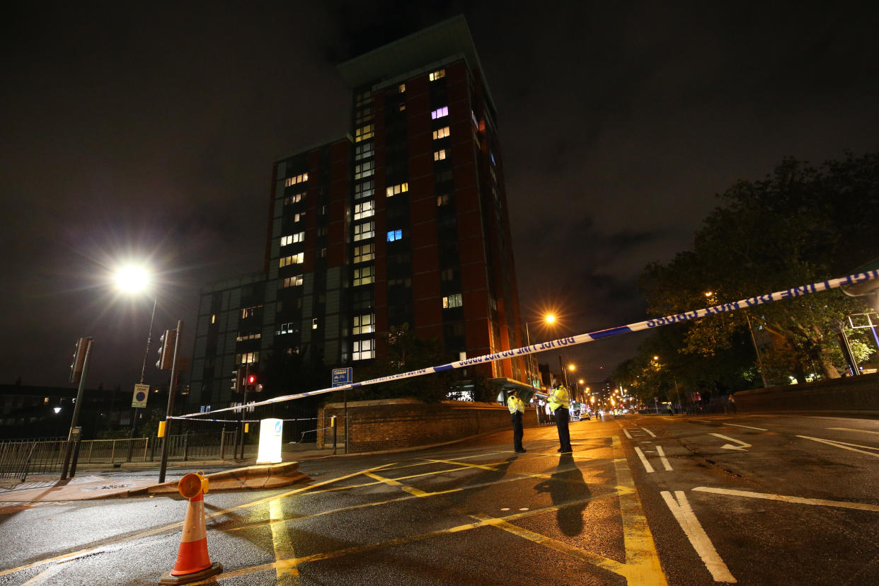 Police cordon at the junction of Chrisp Street and East India Dock Road (A13), Poplar in London, after a toddler was taken to hospital after falling from a block of flats in east London. The Metropolitan police have not confirmed the block of flats, but said they were called to East India Dock Road in Poplar shortly after 6.50pm on Monday to reports that a child had "fallen from height."