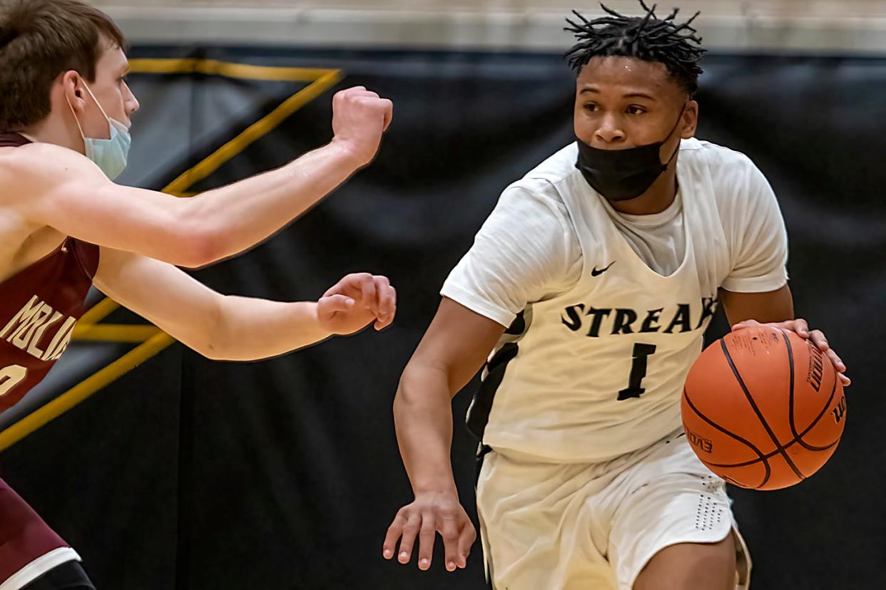 Galesburg High School senior point guard Jeremiah Babers brings the ball up the court during the Silver Streaks' 77-59 WB6 Conference loss to Moline on Friday, Dec. 3, 2021 at John Thiel Gymnasium.