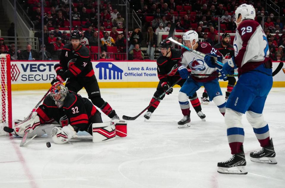 Carolina Hurricanes goaltender Antti Raanta (32) stops the shot attempt by Colorado Avalanche center Nathan MacKinnon (29) during the second period at PNC Arena.