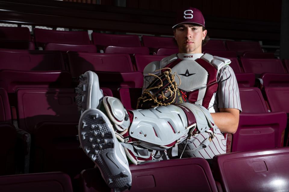 Sinton senior Blake Mitchell, 18, wears his catcher's gear and sits in the stands at the high school's baseball field, Feb. 16, 2023, in Sinton, Texas.