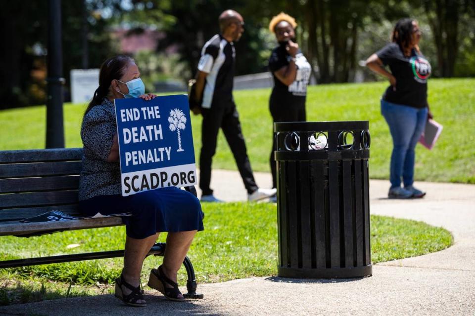 On June 17, 2021, a protester called for the end of the death penalty at a rally and memorial for the nine people killed by Dylann Roof. A federal appeals court upheld Roof’s conviction and death sentence two months later, on Aug. 25, 2021.