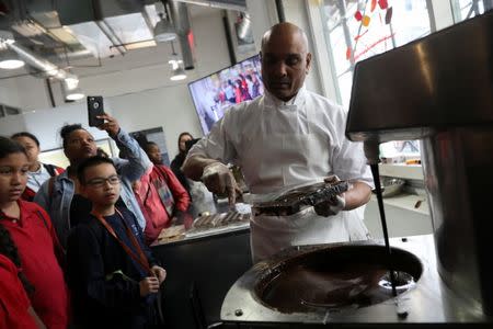 A man gives a chocolate demonstration inside The Chocolate Museum in New York, U.S., May 10, 2017. REUTERS/Shannon Stapleton