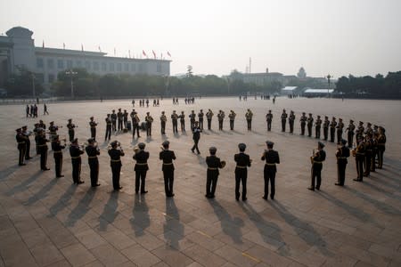 A military brass band rehearses in Tiananmen Square before a wreath laying ceremony marking the 70th anniversary of the founding of the People's Republic of China in Beijing