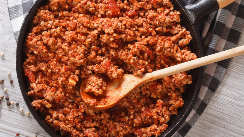 Seasoned ground meat in a frying pan