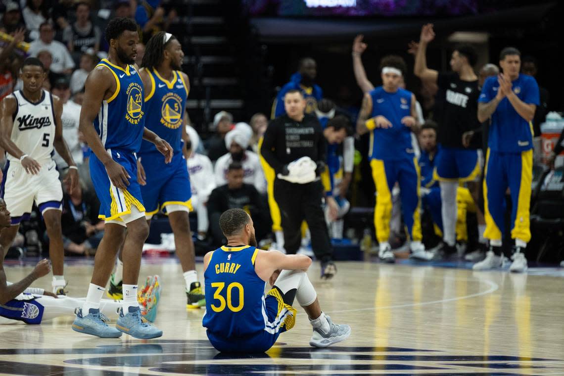 Golden State Warriors guard Stephen Curry (30) sits on the court after a broken play against the Sacramento Kings during an NBA play-in game at Golden 1 Center on Tuesday, April 16, 2024.