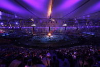 The Olympic torch is lit during the Opening Ceremony at the 2012 Summer Olympics, Friday, July 27, 2012, in London. (AP Photo/Charlie Riedel)