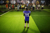 <p>Adults applaud a Sharklets player after his team was defeated by the Eagles during their Future League American football youth league match in Beijing, May 26, 2017. (Photo: Thomas Peter/Reuters) </p>