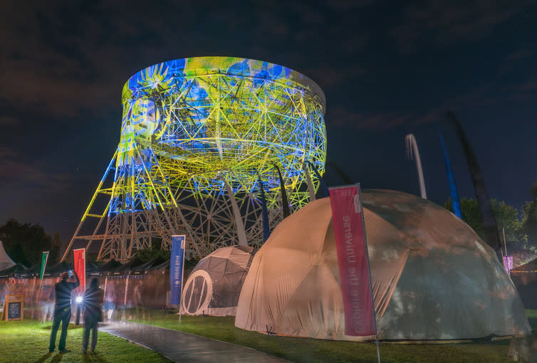 <span class="caption">The Lovell radio telescope of Jodrell bank lit up during the Bluedot festival by the Brian Eno art installation project.</span> <span class="attribution"><a class="link " href="https://www.flickr.com/photos/jixxer/27926674913/in/photolist-JxMvv4-JxubCt-KBMc95-JJ6iEA-KBMf3G-KevjpW-KevkYC-KxG7RB-KED2nP-KEDehv-Kvd9BQ-JJ6s25-KtAZfJ-JZk71m-K4sALu-K4sHaG-Jy2AZd-K4sTGy-Jy9U4D-Jy9SRi-Jy2fLs-Jy9JzZ-Jy25S9-Jy9eCF-KuxpaP-KrGoVG-KkakSG-KnEonv-Jy9kqx-K4scYA-KnEgSX-Jy9x1r-KrG4v9-KrFYtL-Jy9SWi-Kka76y-KuxhJT-Jy26Wo-Jy2Awj-K4sCXJ-K4sn13-Jy2oHj-Jy26K1-KrGkSY-Jy22xU-KrFX39-KnDXWM-K4sn49-Jy2jqm-Jy2wT7" rel="nofollow noopener" target="_blank" data-ylk="slk:Kris Williams/Flickr;elm:context_link;itc:0;sec:content-canvas">Kris Williams/Flickr</a>, <a class="link " href="http://creativecommons.org/licenses/by/4.0/" rel="nofollow noopener" target="_blank" data-ylk="slk:CC BY;elm:context_link;itc:0;sec:content-canvas">CC BY</a></span>