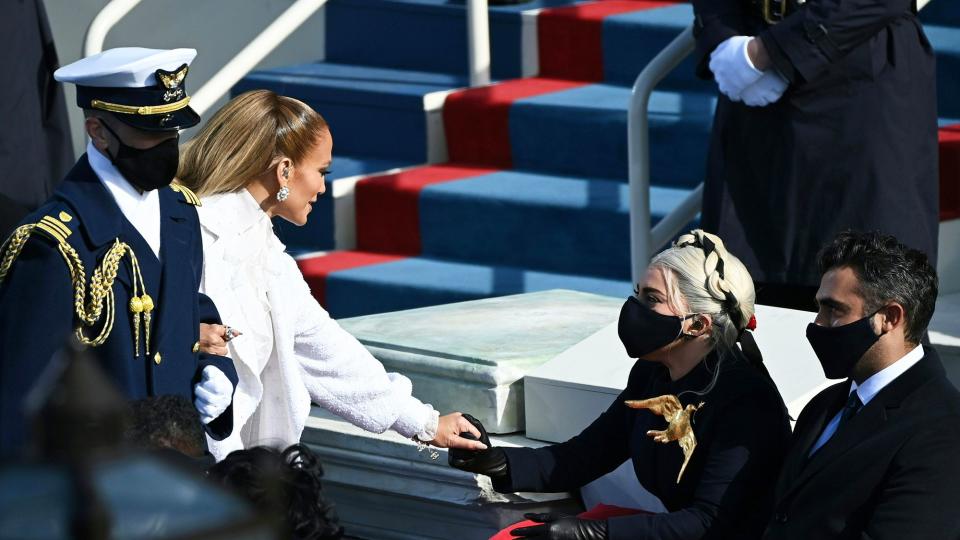 Jennifer Lopez greets Lady Gaga (R) flanked by Michael Polansky at the 59th Presidential Inaguruation in Washington, DC