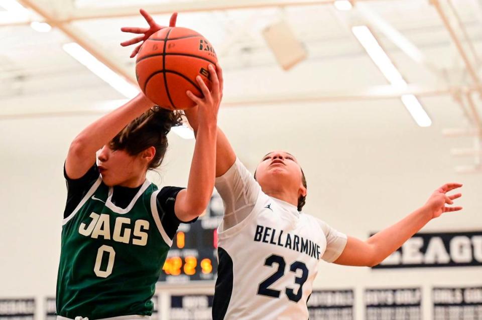 Emerald Ridge guard Naomi Sanato (0) grabs a rebound away from Bellarmine Prep guard Jada Travis (23) during the first quarter of a 4A South Puget Sound League game on Friday, Jan. 28, 2022, at Bellarmine Prep, in Tacoma, Wash.