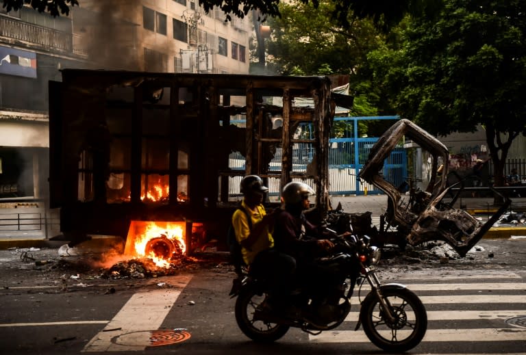 A truck burns during clashes between Venezuelan opposition activists and the police, in Caracas, on July 18, 2017