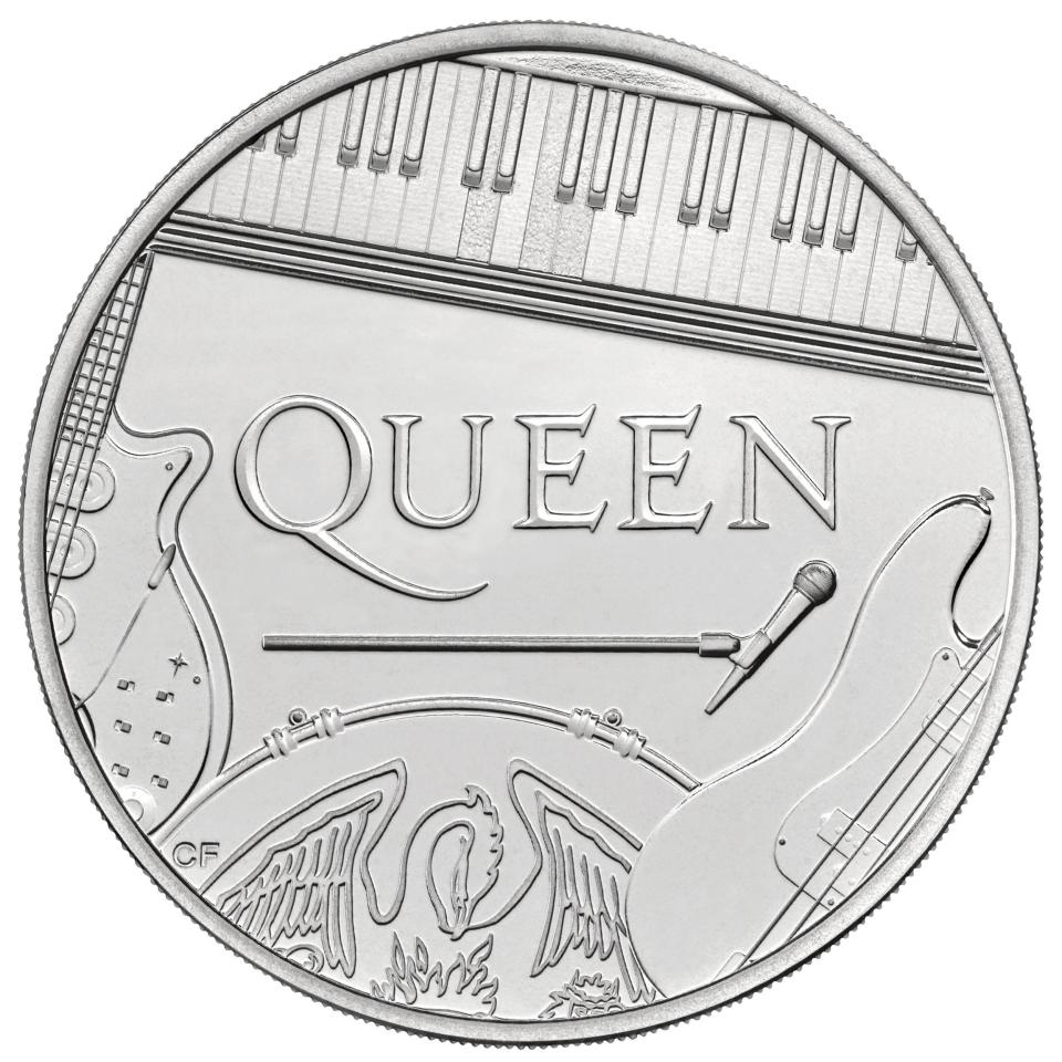The instruments of all four band members feature on the coin (PA)
