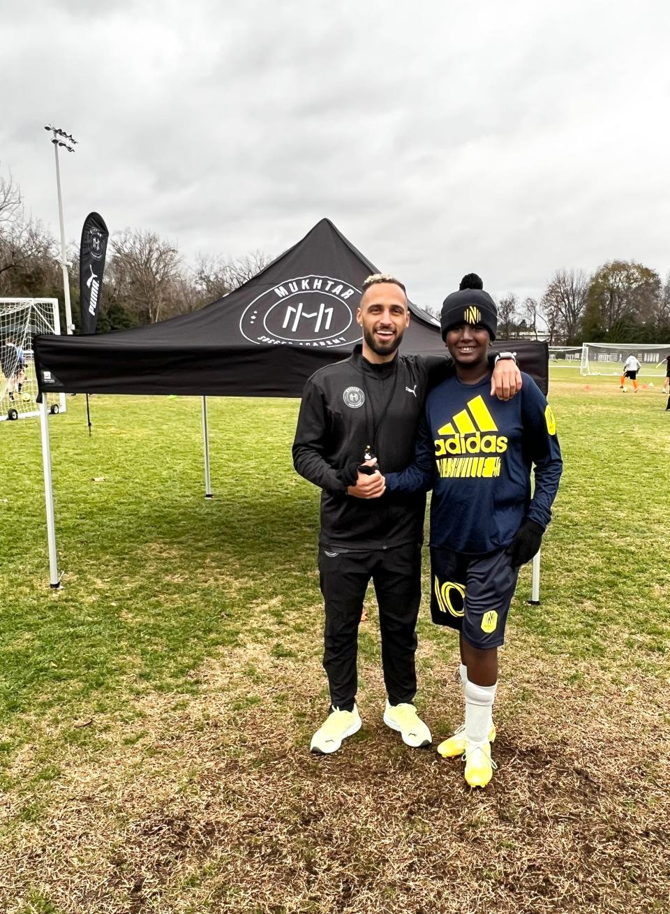 Nashville Soccer Club forward Hany Mukhtar (left) shakes hands with youth soccer camper Elijah Eatherly (right) at the inaugural Mukhtar Soccer Academy clinics at Lipscomb Academy. Nov. 27, 2022.