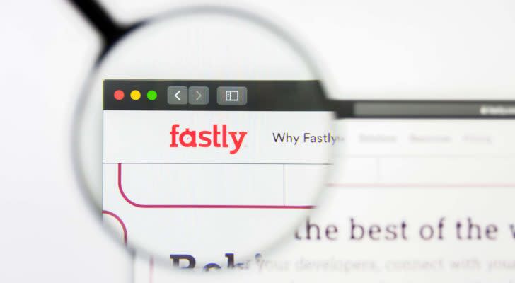 A magnifying glass zooms in on the Fastly (FSLY) website.