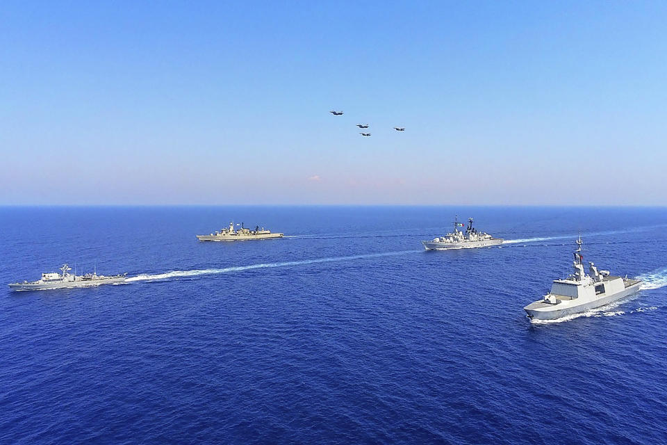 In this photo provided on Monday, Aug. 31, 2020, by the Greek Defense Ministry, warships from Greece, Italy, Cyprus and France, participate in a joint military exercise which was held from 26-28 of August, south of Turkey in eastern Mediterranean sea. Turkey on Monday, Aug. 31, accused Greece of "piracy" and warned it will stand up to Athens' alleged efforts to militarize islands near its coast. (Greek Defense Ministry via AP)