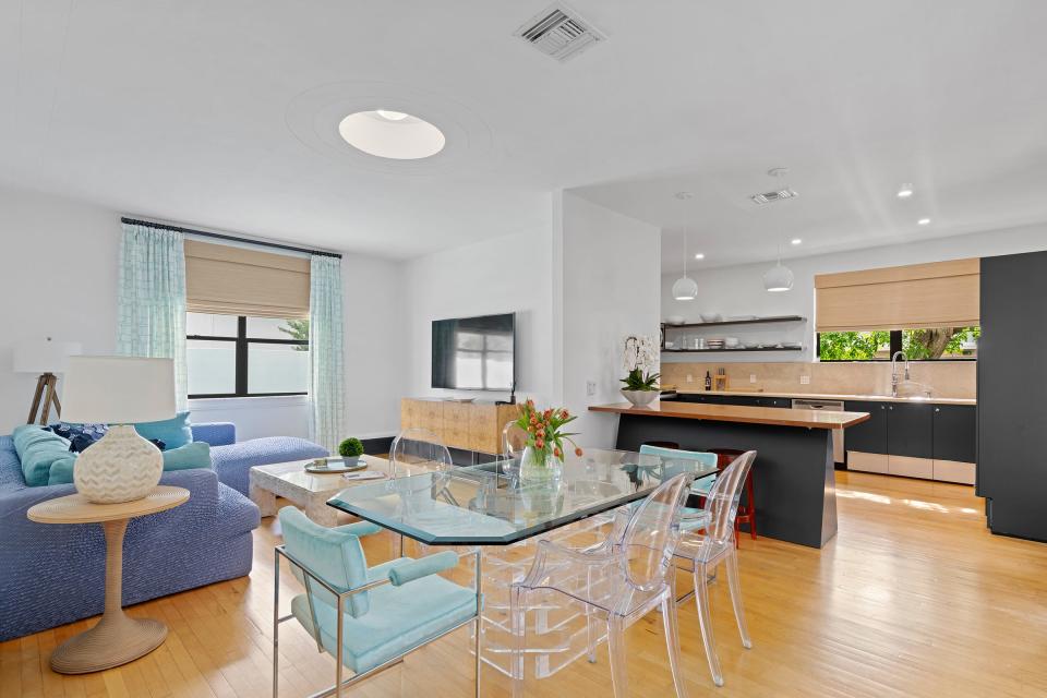 Hardwood floors in the family room continue into the dining area and kitchen.