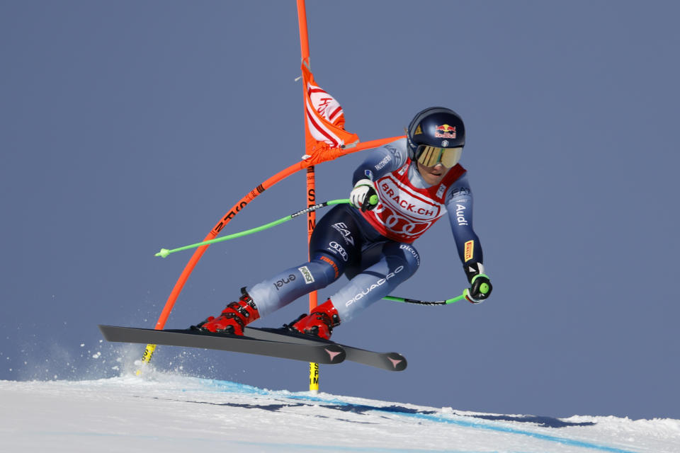 Italy's Sofia Goggia is airborne during an alpine ski, women's World Cup downhill race, in St. Moritz, Switzerland, Saturday, Dec.9, 2023. (AP Photo/Giovanni Maria Pizzato)