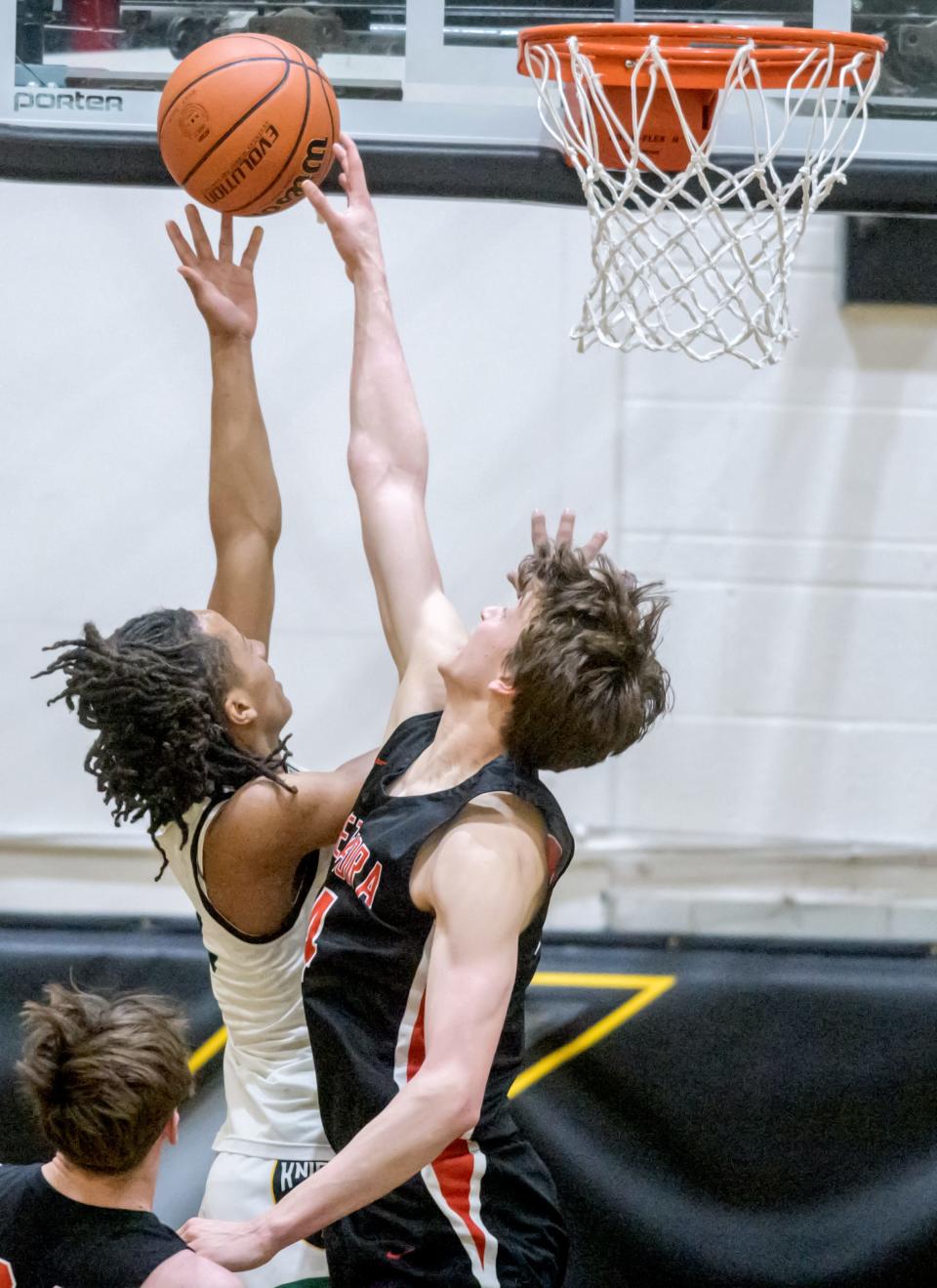 Metamora's Luke Hopp, right, defends against Richwoods' Marquel Newsom during the Class 3A sectional title game Friday, March 3, 2023 at Galesburg High School. The Redbirds defeated the Knights 65-60.