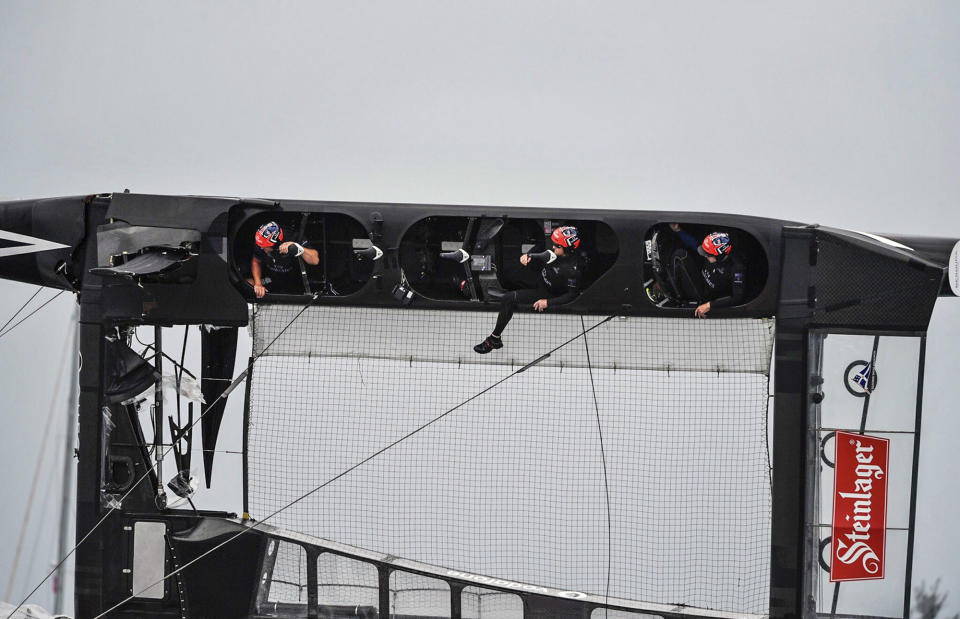 <p>In this photo provided by America’s Cup Event Authority, members of the crew of Emirates Team New Zealand hold on as their boat is righted after capsizing during an America’s Cup challenger semifinal against Great Britain’s Land Rover BAR on the Great Sound in Bermuda on Tuesday, June 6, 2017. (Ricardo Pinto/ACEA via AP) </p>