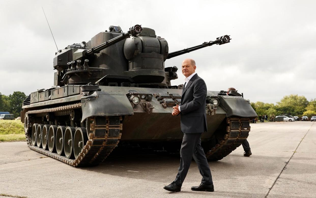 Olaf Scholz next to a tank - Morris MacMatzen/Getty