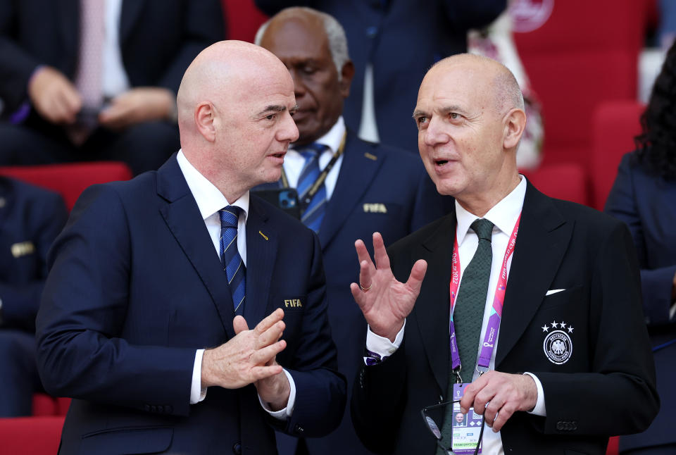 DOHA, QATAR - NOVEMBER 23: German Football Association President Bernd Neuendorf (R) speaks with Gianni Infantino, President of FIFA, during the FIFA World Cup Qatar 2022 Group E match between Germany and Japan at Khalifa International Stadium on November 23, 2022 in Doha, Qatar. (Photo by Alexander Hassenstein/Getty Images)