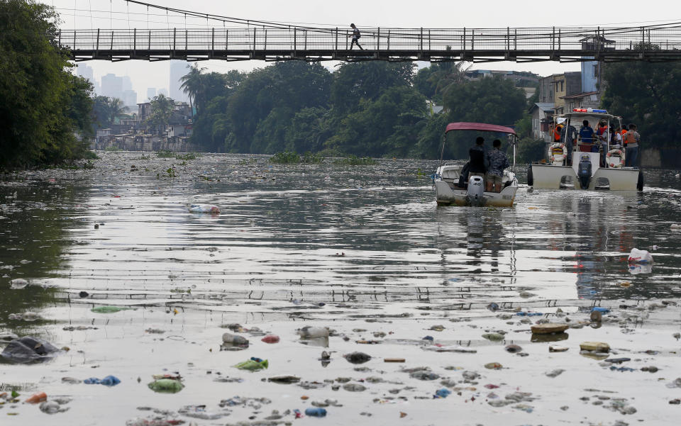 The Government's Pasig River Rehabilitation Commission and environmentalists from Greenpeace survey the polluted Pasig River to track plastic waste to draw attention to the hazards of plastics and waste which clog rivers and tributaries, Friday, Sept. 8, 2017, in San Juan city, east of Manila, Philippines. In a statement the environmental group urges ASEAN governments to stiffen policies on waste management and to arrest the rising rate of waste being dumped into the ocean and finding their way to the open seas. (AP Photo/Bullit Marquez)