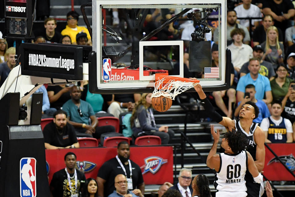 San Antonio Spurs rookie Victor Wembanyama dunks the ball over the Portland Trail Blazers' Justin Minaya at the Thomas & Mack Center in Las Vegas on July 9, 2023. (Allen Berezovsky/Getty Images)