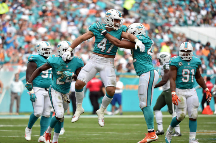 Nov 6, 2016; Miami Gardens, FL, USA; Miami Dolphins linebacker Kiko Alonso (left) celebrates with Dolphins safety Isa Abdul-Quddus (right) after a play during the second half against the New York Jets at Hard Rock Stadium. The Dolphins won 27-23. Mandatory Credit: Steve Mitchell-USA TODAY Sports