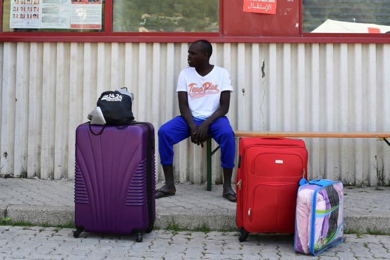 A migrant waits for a a host house at the Italian Red Cross camp in Ventimiglia on June 15, 2018