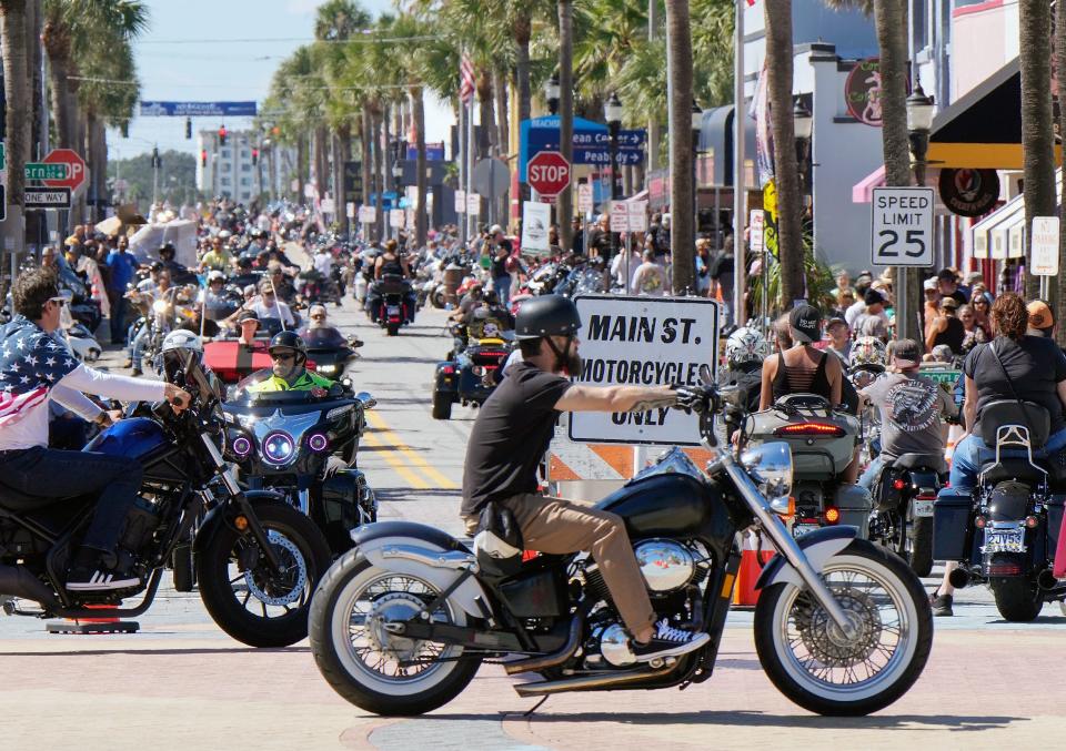 Bikers cruise Main Street on Friday as the annual Bikertoberfest event shifted into high gear in Daytona Beach. The four-day event is expected to draw an estimated 100,000 visitors to the area through Sunday.