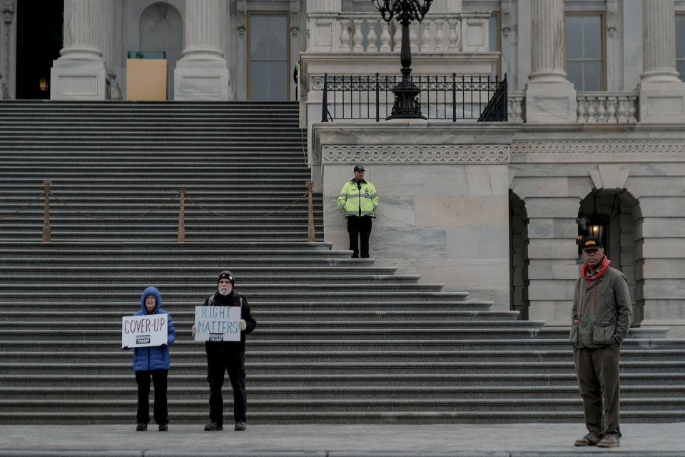 A few protestors demonstrate outside the senate chamber during the impeachment trial Saturday morning in Washington, D.C., on Jan. 25, 2020. | Gabriella Demczuk for TIME