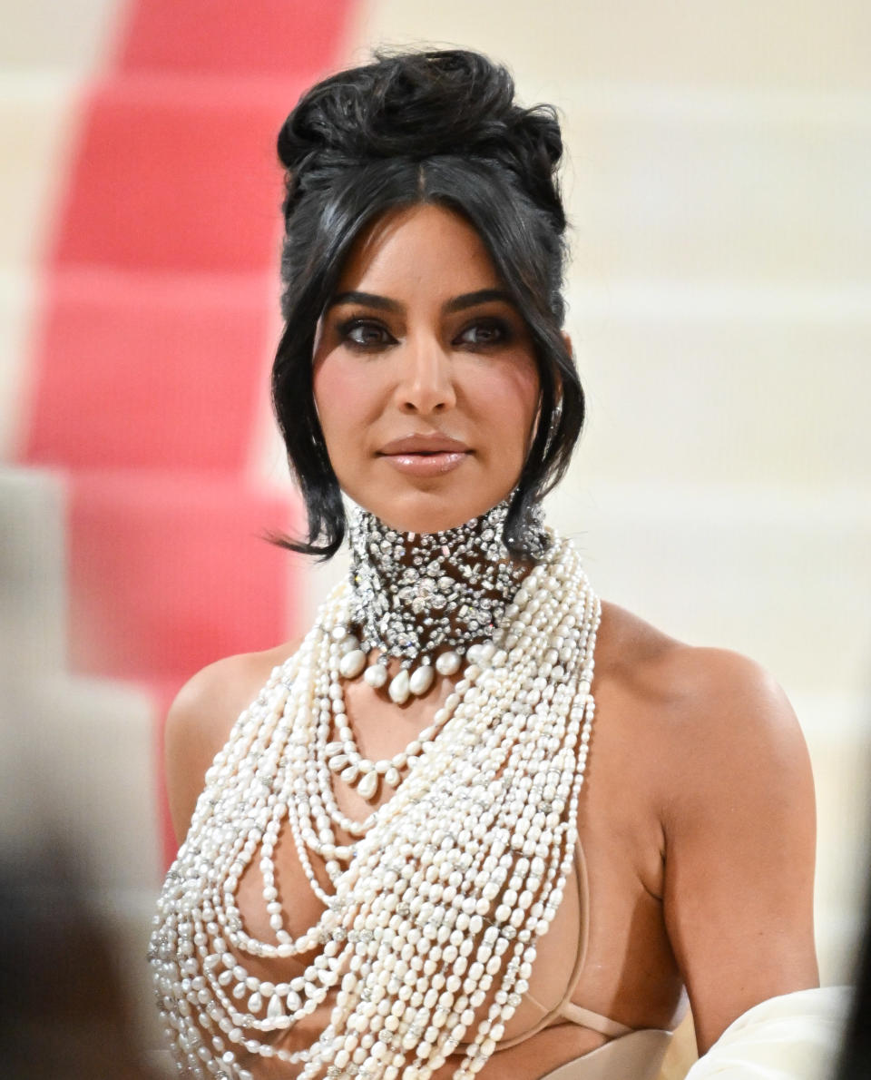 Close-up of Kim in a beaded halter-top outfit