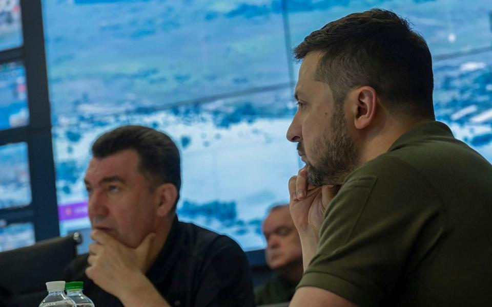 Ukrainian president Volodymyr Zelenskyy (right) chairs an emergency meeting of the National Security and Defense Council on June 6 after the Nova Kakhovka dam was blown up overnight - Ukrainian Presidential Office