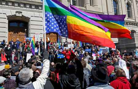 FILE PHOTO: Demonstrators gather at Monument Circle to protest a controversial religious freedom bill recently signed by Governor Mike Pence, during a rally in Indianapolis March 28, 2015. More than 2,000 people gathered at the Indiana State Capital Saturday to protest Indiana's newly signed Religious Freedom Restoration Act saying it would promote discrimination against individuals based on sexual orientation. REUTERS/Nate Chute/File Photo