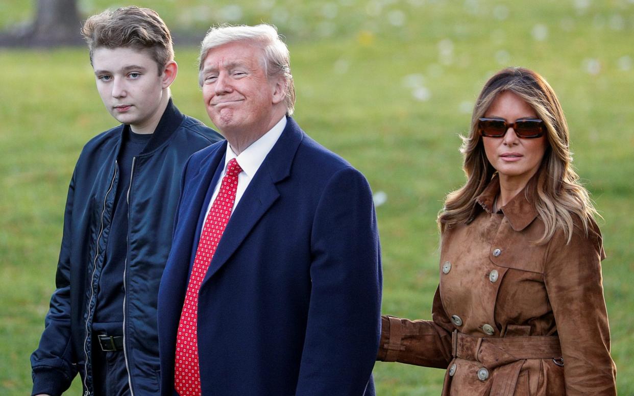 President Donald Trump, the First Lady and son Barron at the White House last month - REUTERS