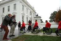 Members of U.S. Paralympics team arrive to be greeted by President Barack Obama at the White House in Washington, U.S., September 29, 2016. REUTERS/Yuri Gripas