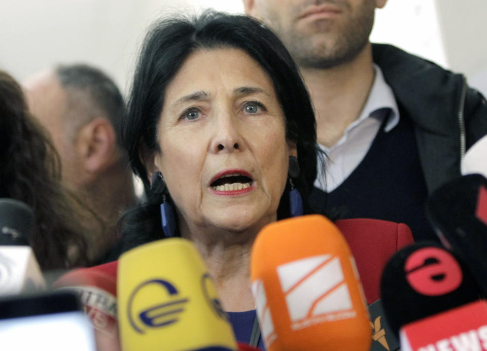 Salome Zurabishvili, former Georgian Foreign minister and presidential candidate, speaks to the media at a polling station during the presidential election at the polling station in Tbilisi, Georgia, Sunday, Oct. 28, 2018. Voters in Georgia are choosing a new president for the former Soviet republic, the last time the president will be elected by direct ballot. (AP Photo/Shakh Aivazov)