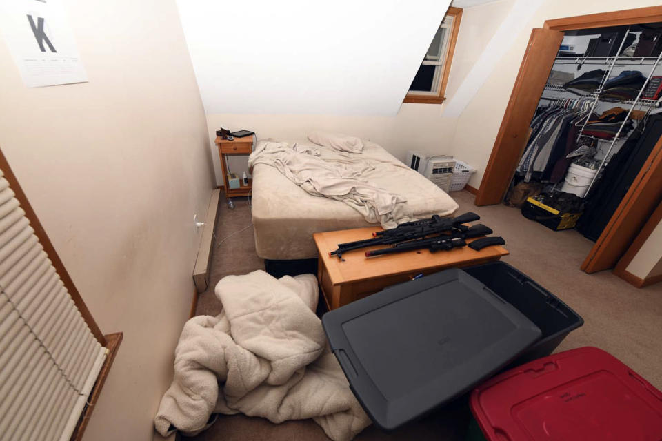 This image contained in Justice Department motion for continued pretrial detention of Jack Teixeira, shows his room at his mother and step-father's home in North Dighton, Mass. A judge has put off a decision on whether the Massachusetts Air National guardsman accused of leaking highly classified military documents should be held in jail until his trial. Prosecutors said Teixeira kept an arsenal of weapons and said on social media that he would like to kill a "ton of people." (Justice Department via AP)